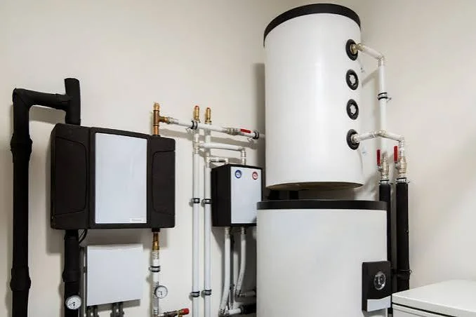 Indoor heating equipment, insulated pipes and a hot-water cylinder.